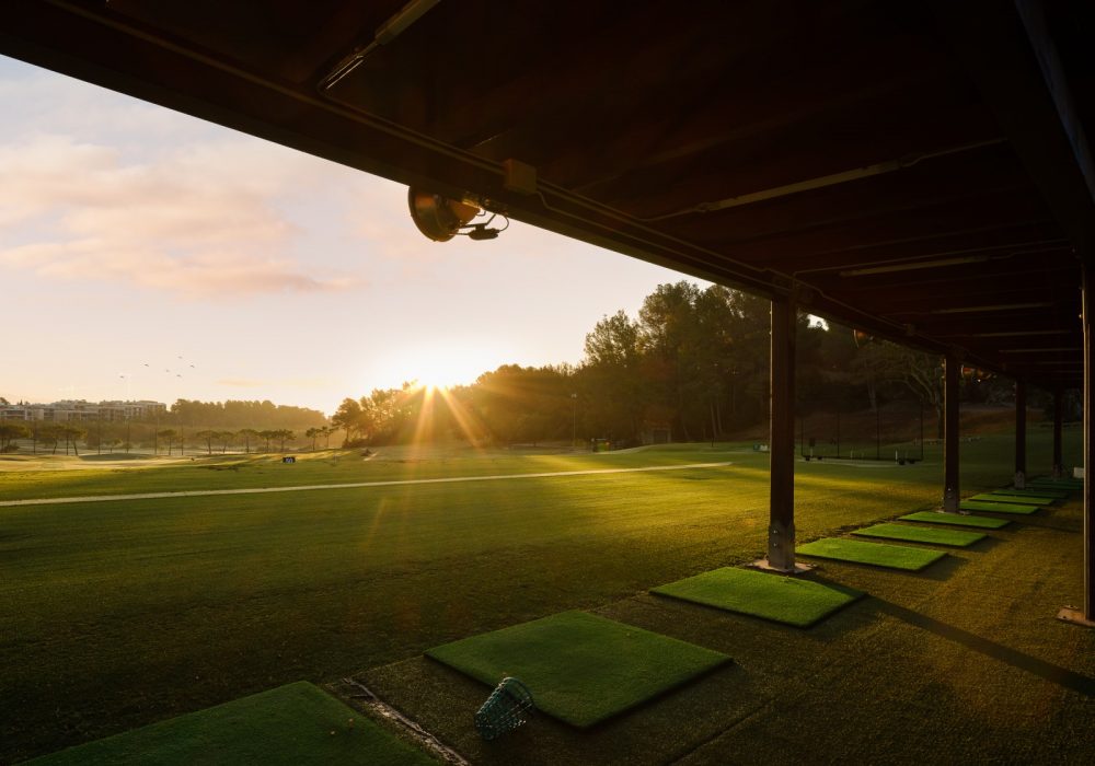 Arabella Golf Resort driving range at golden sunset