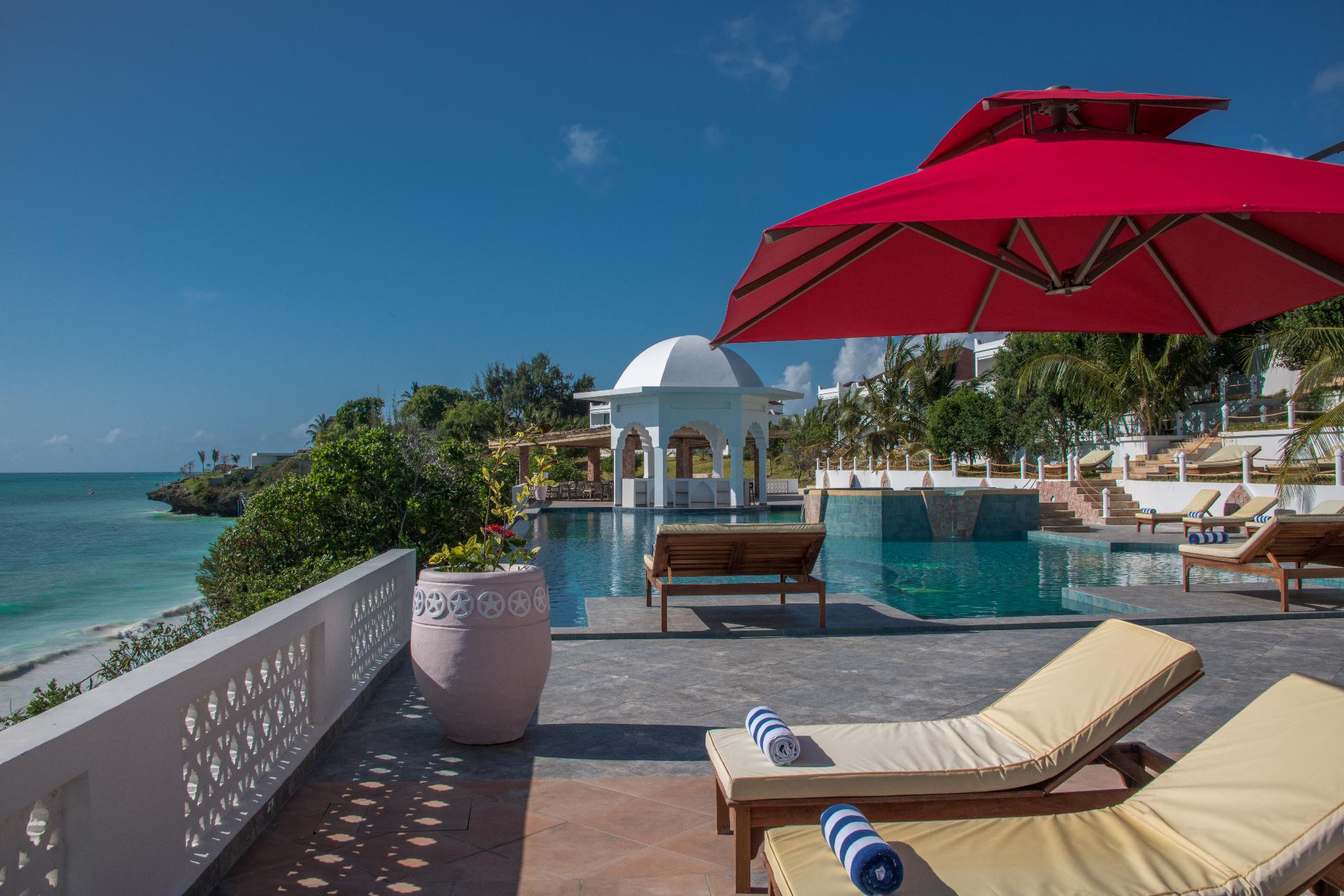 Luxury resort pool deck overlooking the turquoise ocean