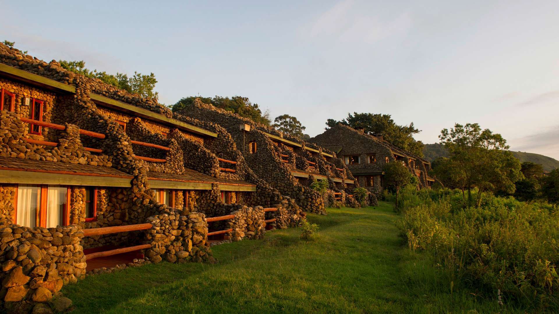 Stone-built Ngorongoro Lodge nestled in lush Tanzanian greenery