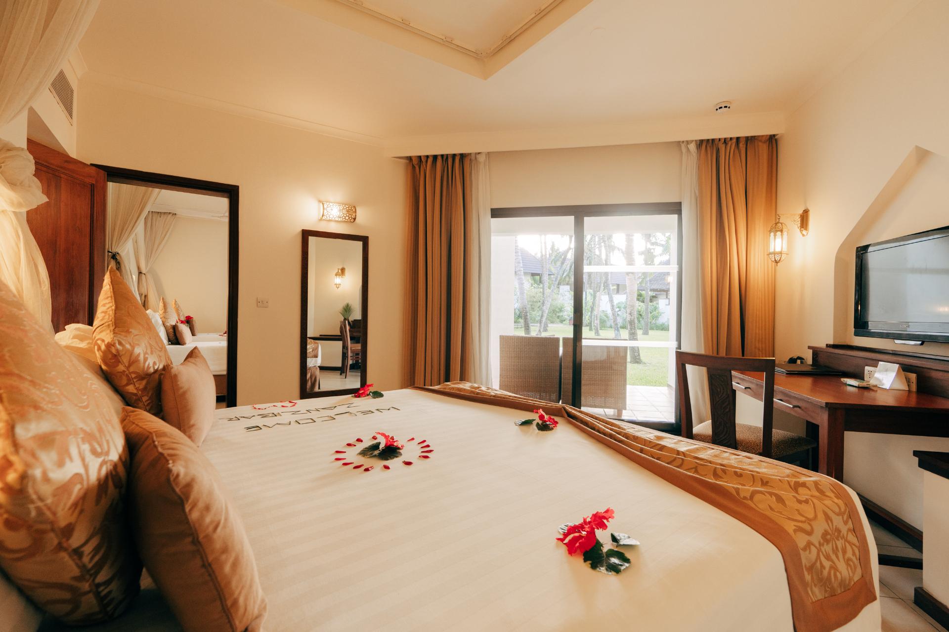Romantically decorated king suite with flower petals